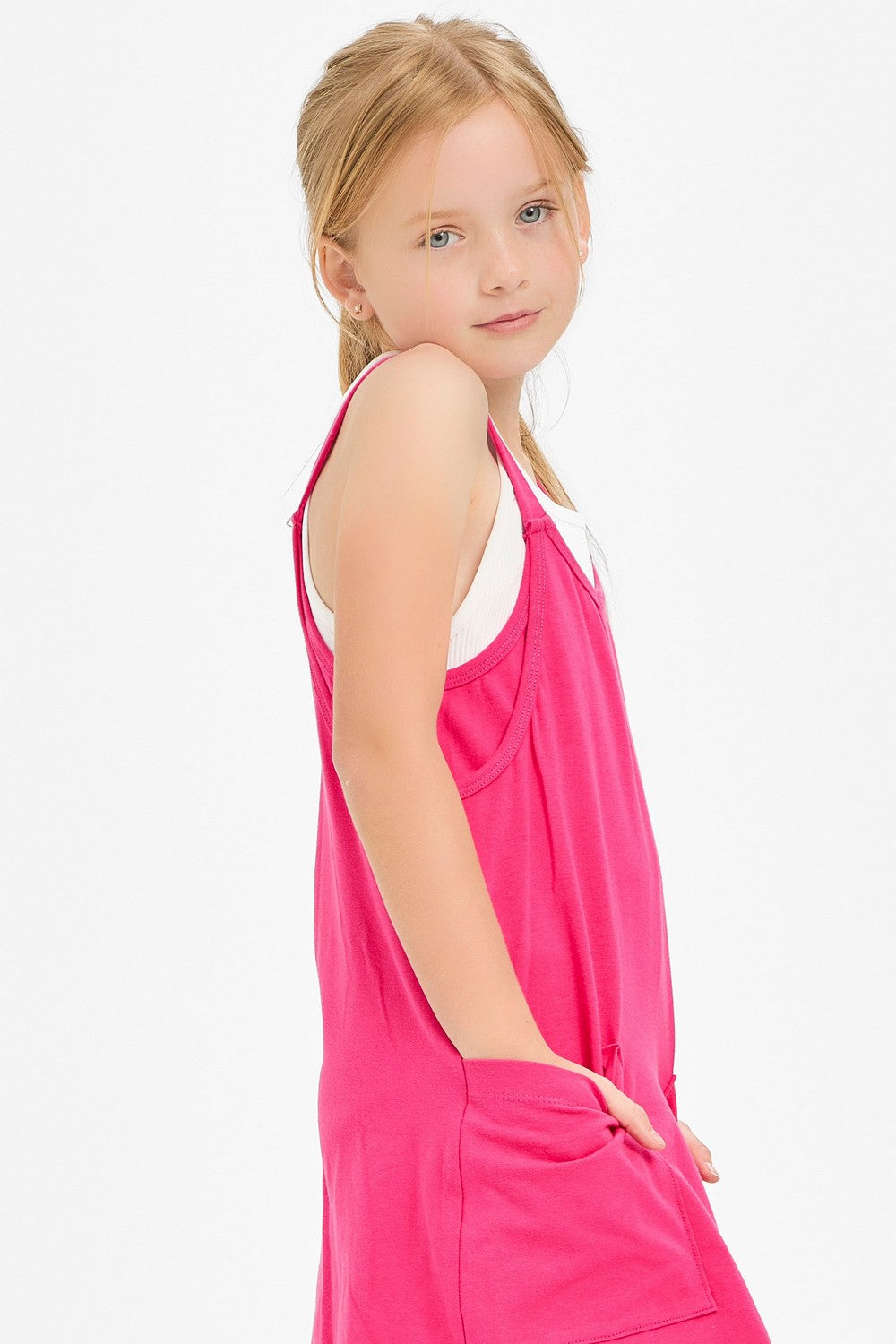 Hot pink romper dress by Good Girl, sleeveless with a fitted waist and stylish design, shown on a model.