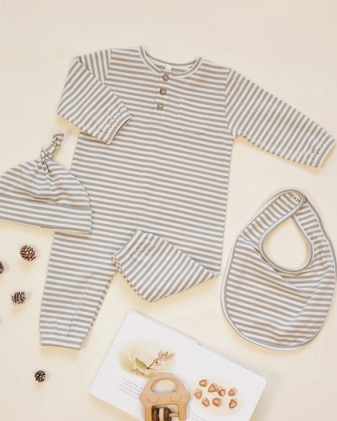 Quincy Mae Laurel Stripe long sleeve pocket jumpsuit for kids, featuring a stylish striped pattern and a front pocket detail.