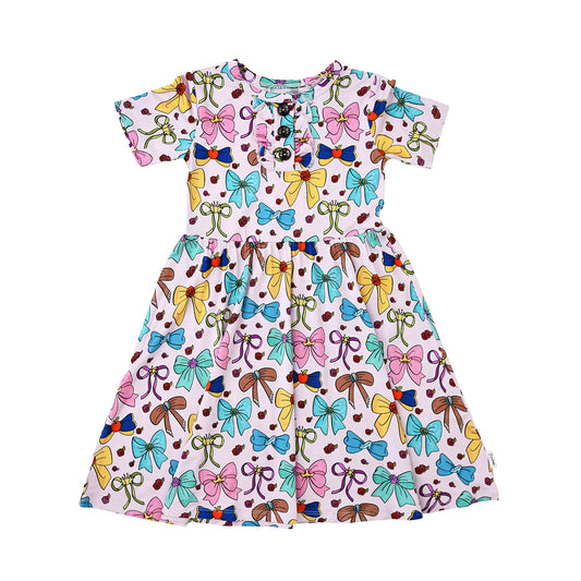 Gigi & Max Princess Bows Twirl Dress for girls with colorful bows and flowing fabric, perfect for special occasions and dress-up.