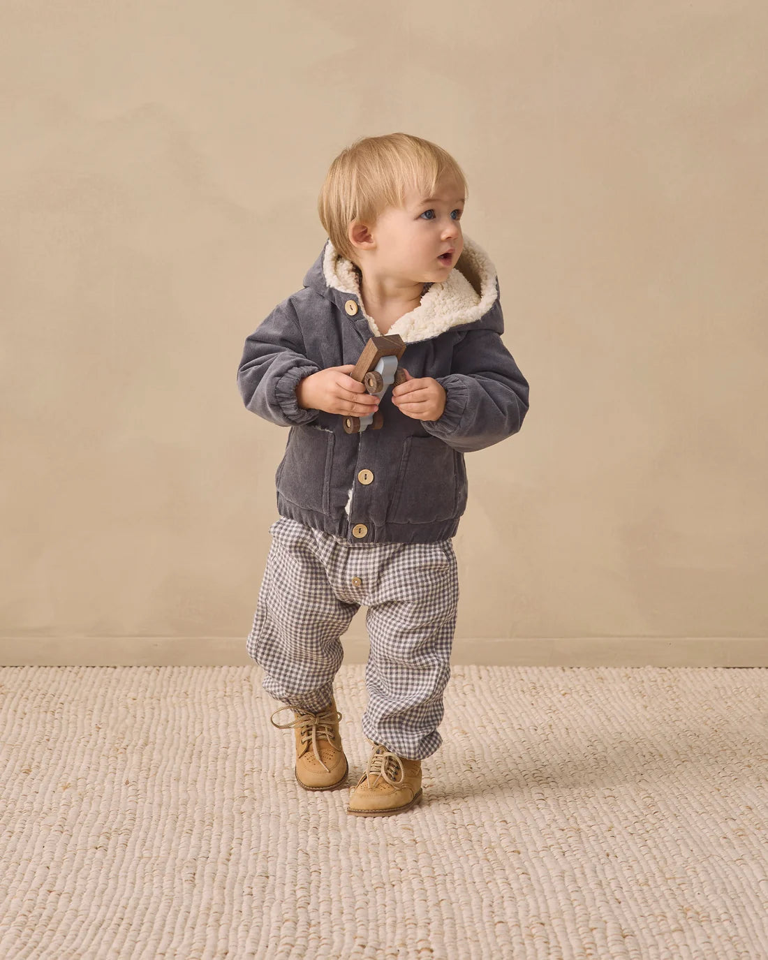 Quincy Mae midnight corduroy hooded jacket for kids, soft textured fabric with front pockets and adjustable hood.