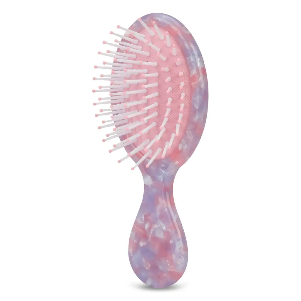 Iscream mini hair brush with a compact design, featuring soft bristles for gentle styling and detangling.