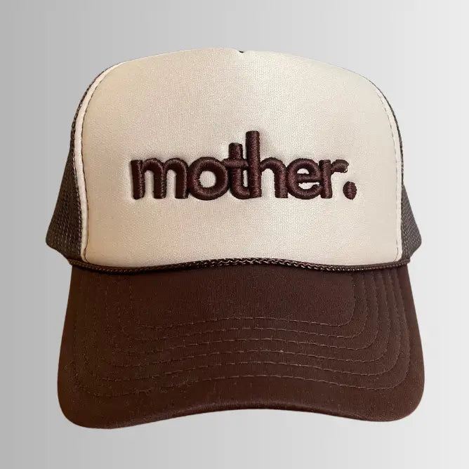 Mother embroidered brown and tan trucker hat with adjustable snapback and curved brim, featuring detailed embroidery on front panel.