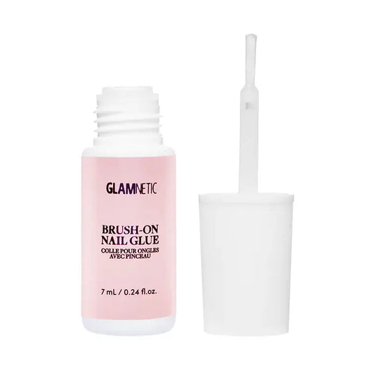 Glamnetic brush-on nail glue in a clear bottle with brush applicator for quick, strong adhesive for nail enhancements.