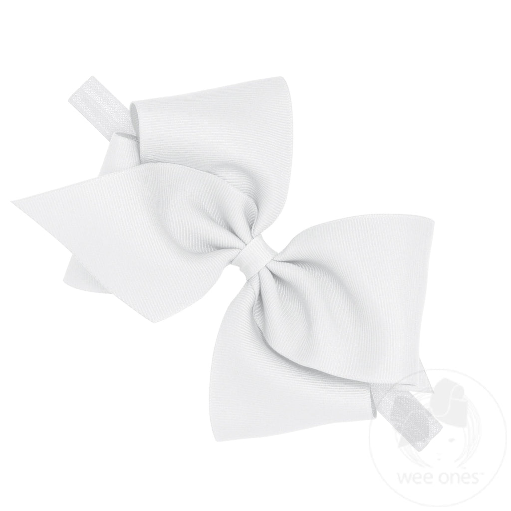 White mini King Classic grosgrain hair bow on a baby headband, designed for girls by Wee Ones.