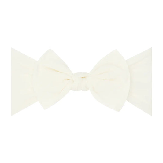 Ivory Baby Bling Bows knot soft nylon headband with bow detail, perfect for infants and toddlers, soft and comfortable for everyday wear.