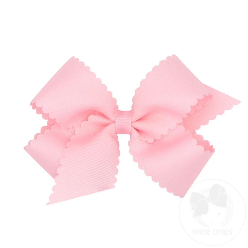 Medium grosgrain hair bow with scalloped edge by wee ones, featuring soft pink color and decorative trim on a white background.