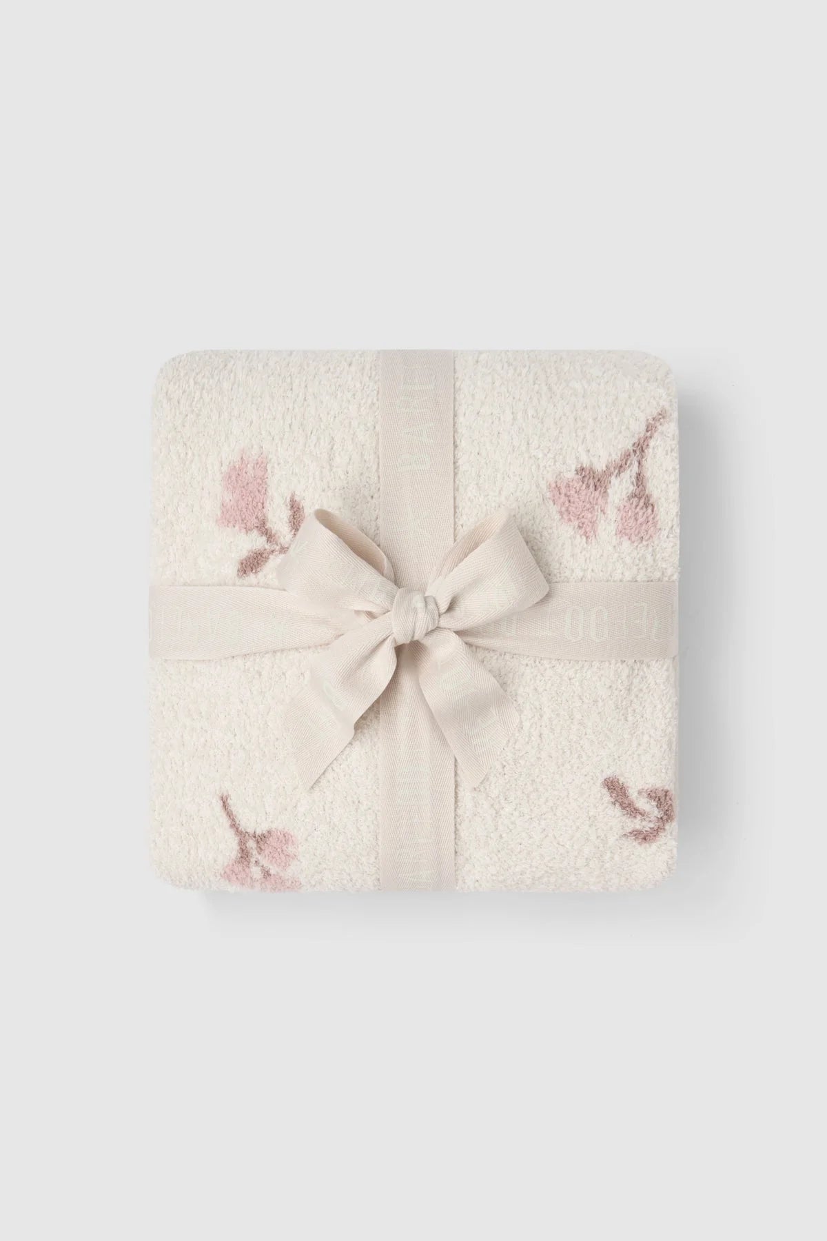 Barefoot Dreams CozyChic Heirloom Floral stroller blanket with faded rose multi-colored bow design for babies.