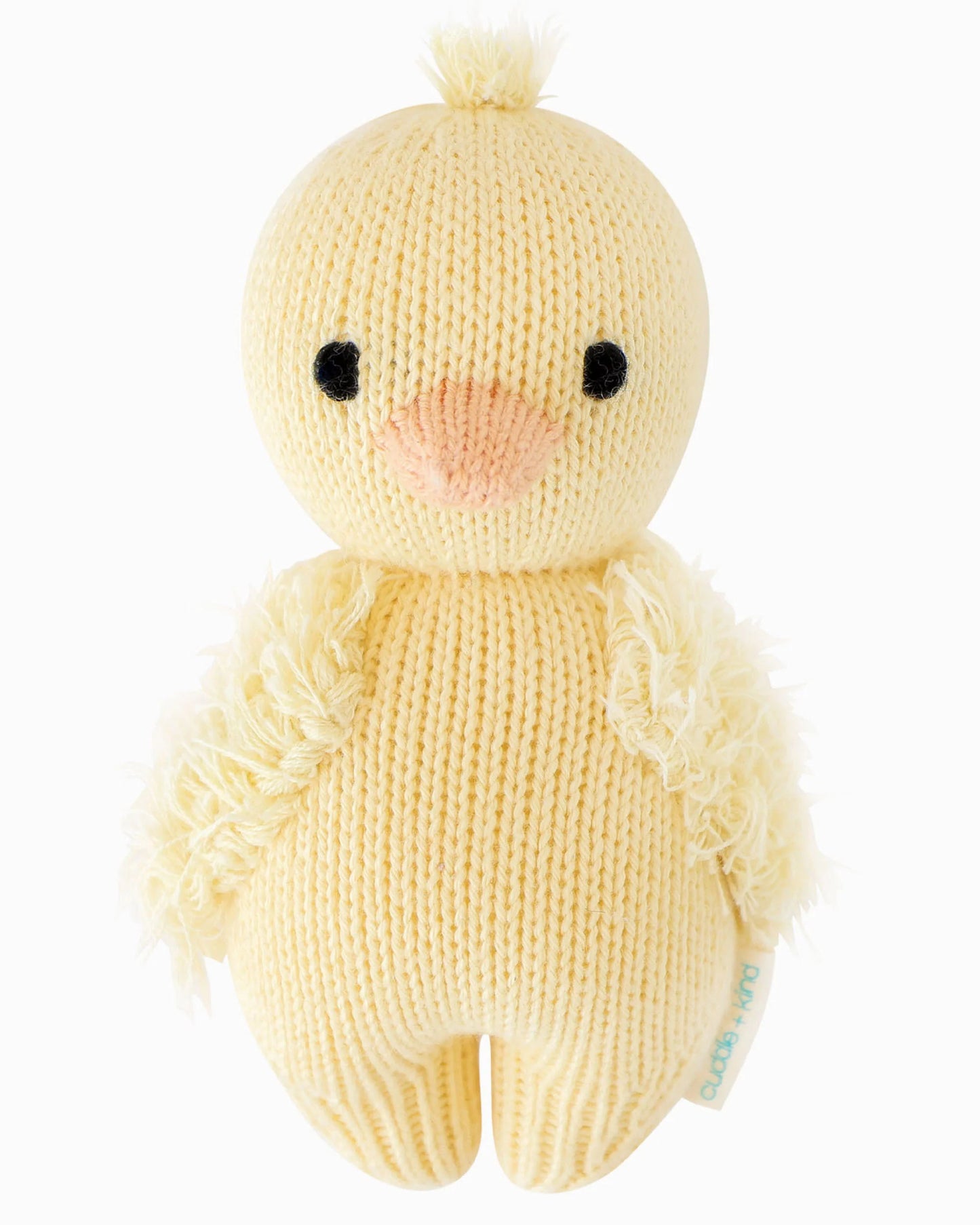 Soft plush baby duckling toy by cuddle + kind, featuring bright yellow feathers and adorable facial details.