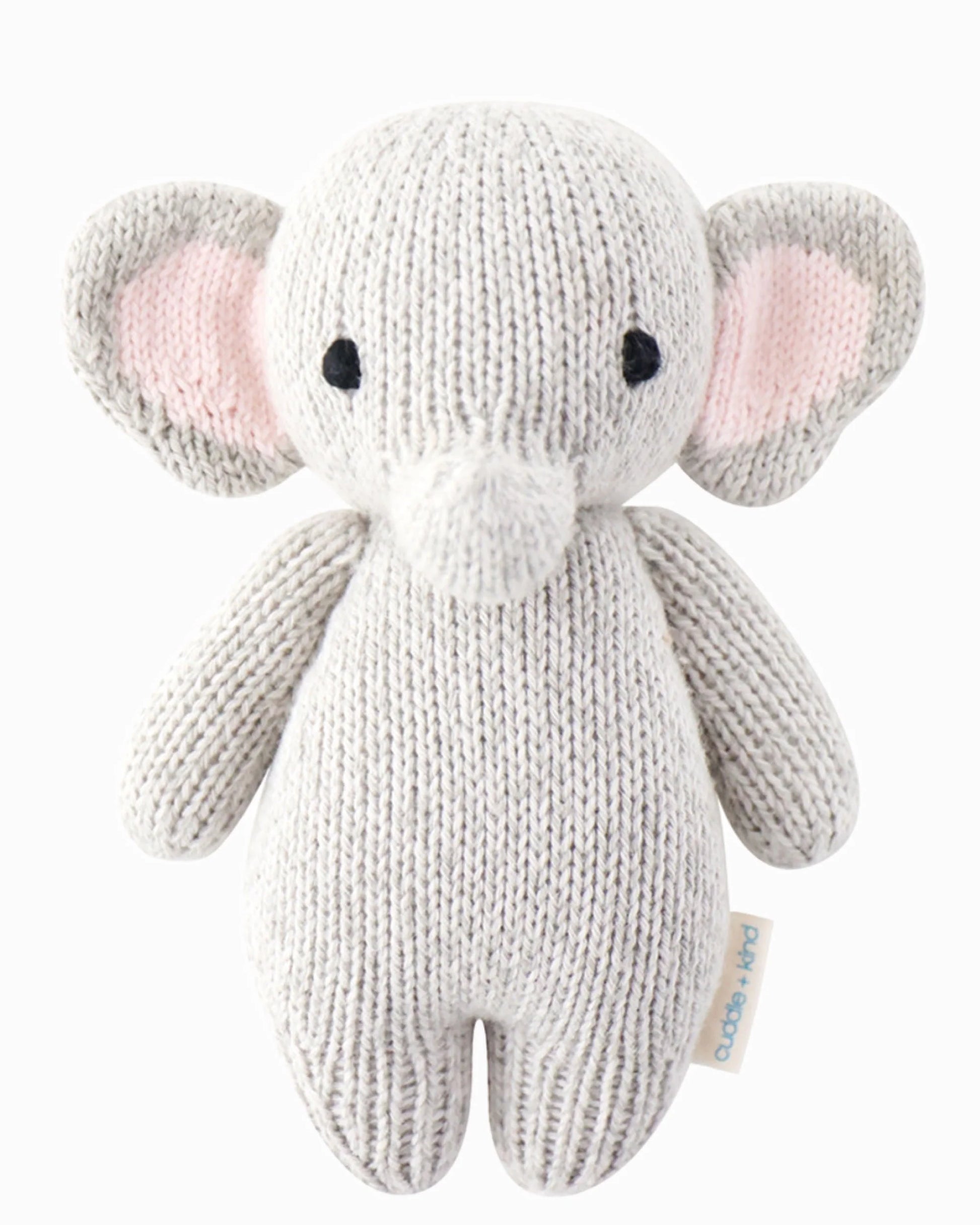 Soft baby elephant plush toy from cuddle + kind with large ears and gentle expression, perfect for cuddling and nursery decor.