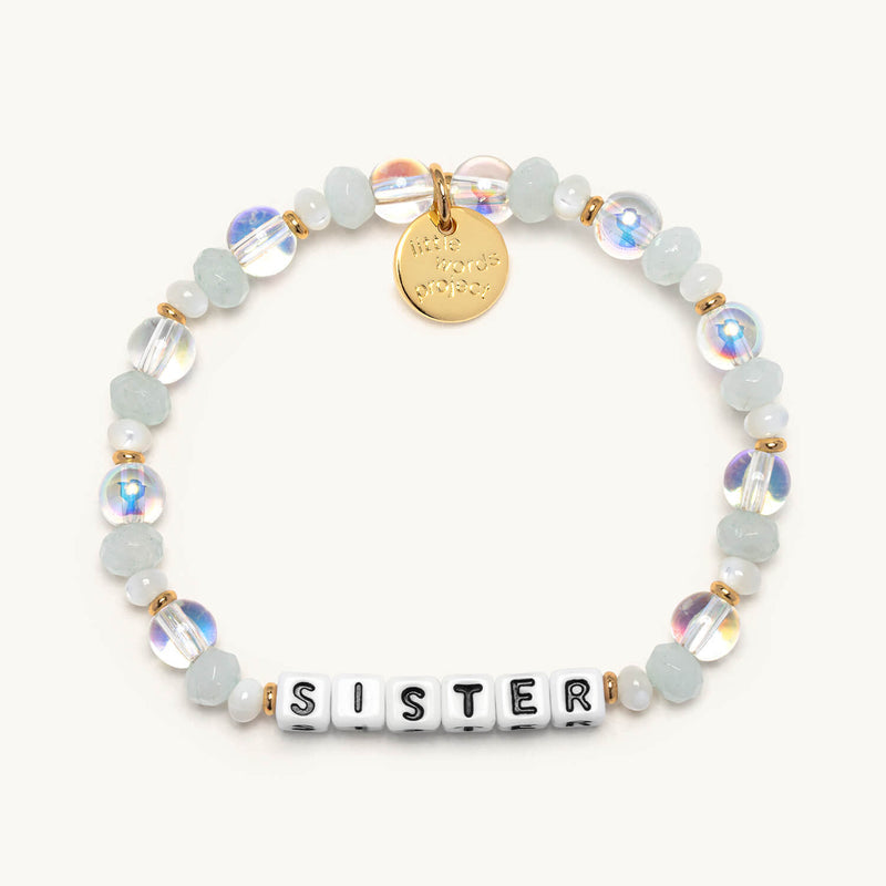 Close-up of Little Words Project bracelet featuring engraved words on a delicate band, showcasing the brand's signature jewelry design.