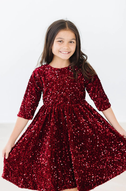 Cranberry velvet sequin dress by Mila & Rose featuring long sleeves and a fitted silhouette for elegant evening wear.