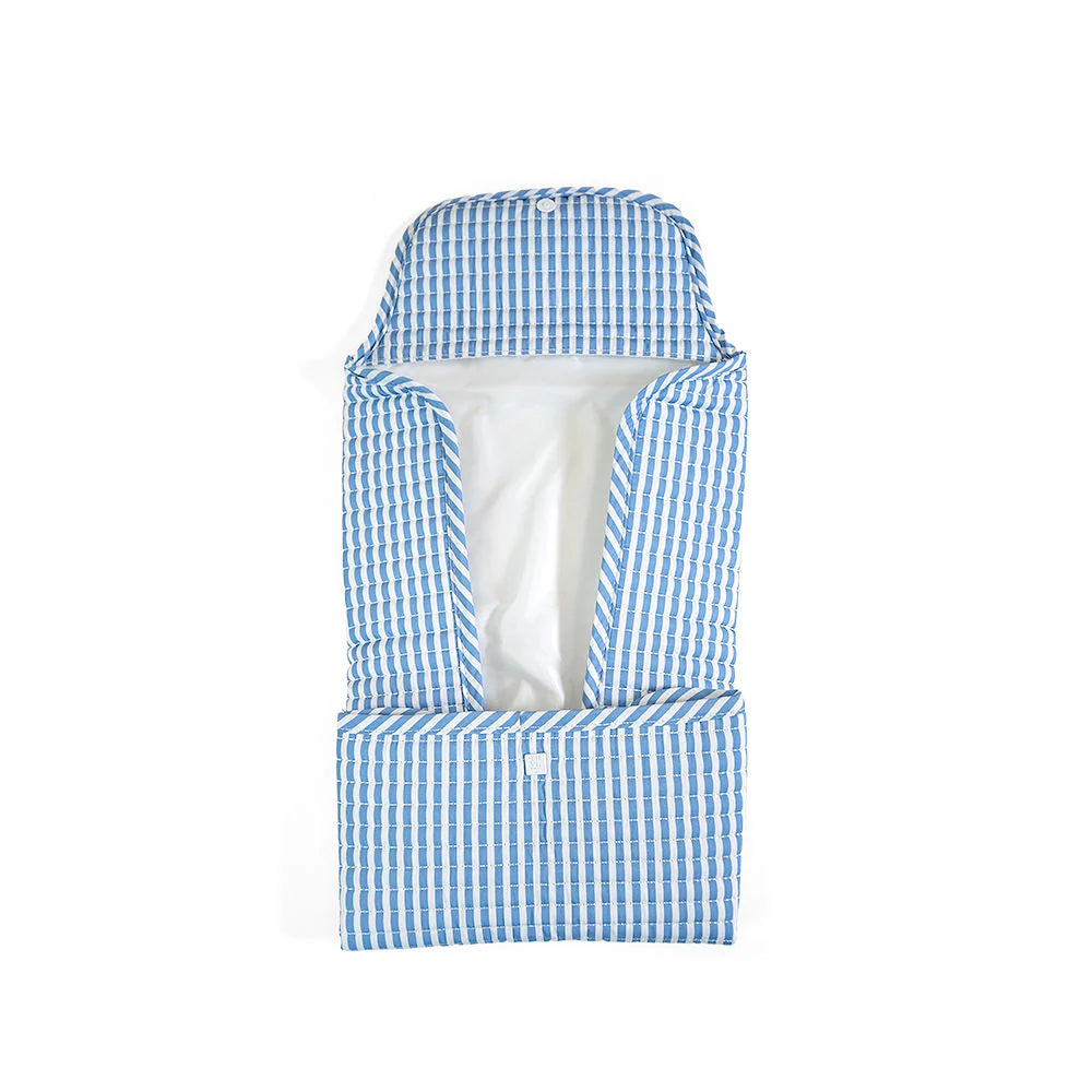 Quilted changing mat by TRVL Designs with soft, padded surface and adjustable straps for comfortable baby diaper changes.