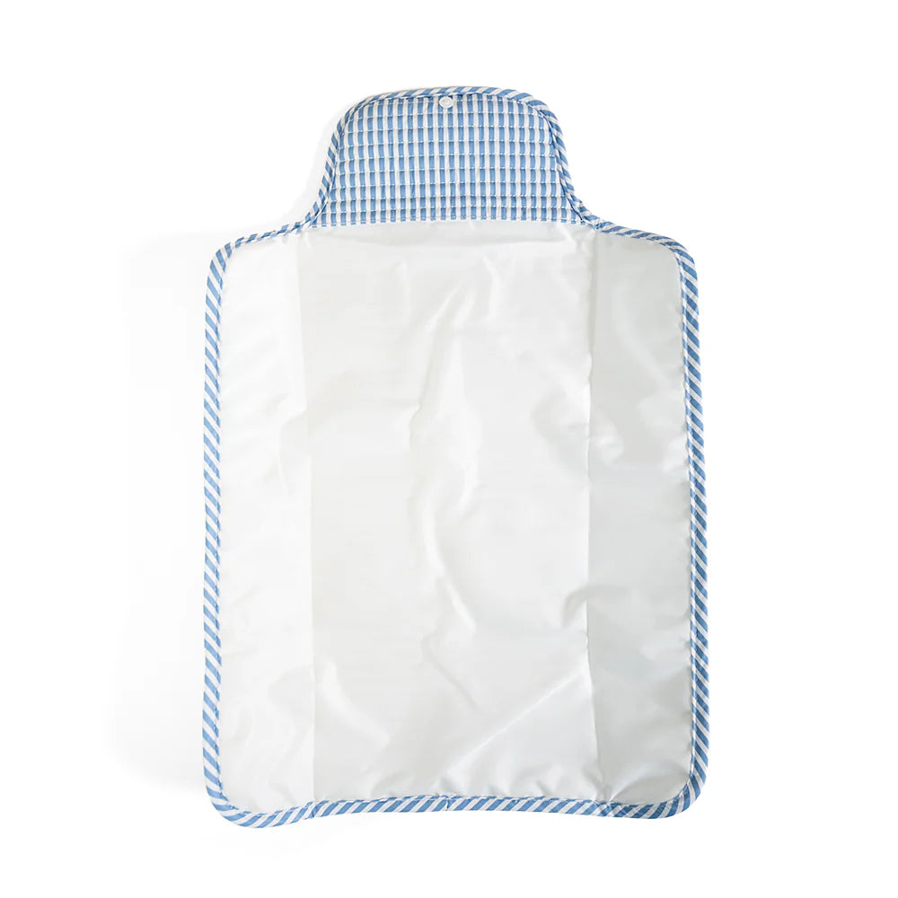 Soft quilted changing mat by TRVL Designs with padded surface and secure edges for comfortable diaper changes.