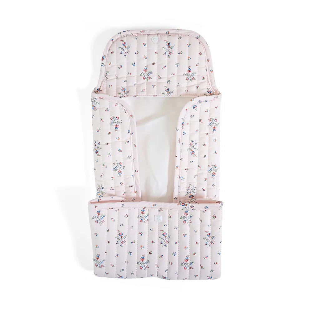 Soft quilted changing mat by TRVL Designs with padded surface, ideal for comfortable diaper changes and easy care.