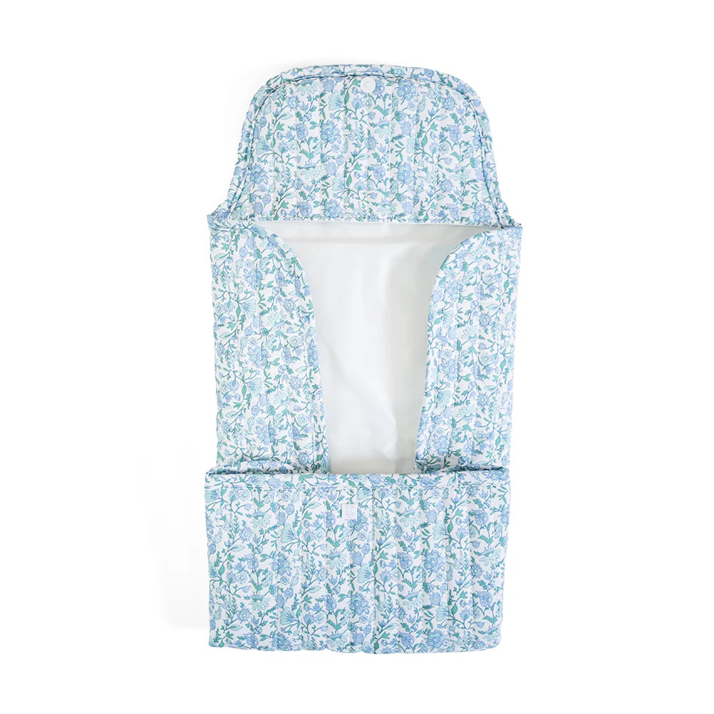 Quilted changing mat by TRVL Designs with soft, padded surface and secure straps for comfortable baby diaper changes.