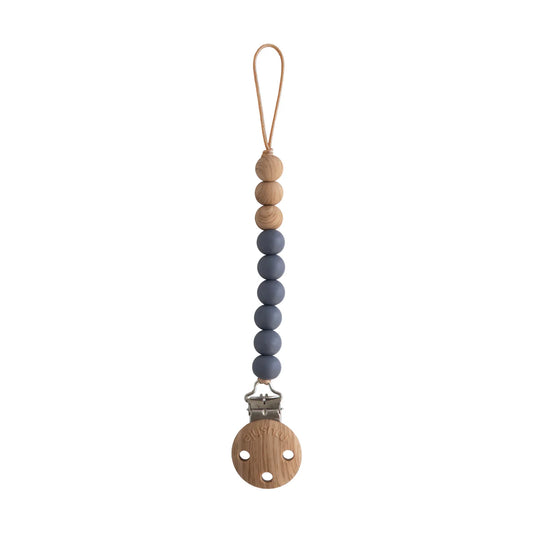Silicone pacifier clip by Mushie featuring Eva design with iron-colored accents and durable silicone beads for baby accessories.