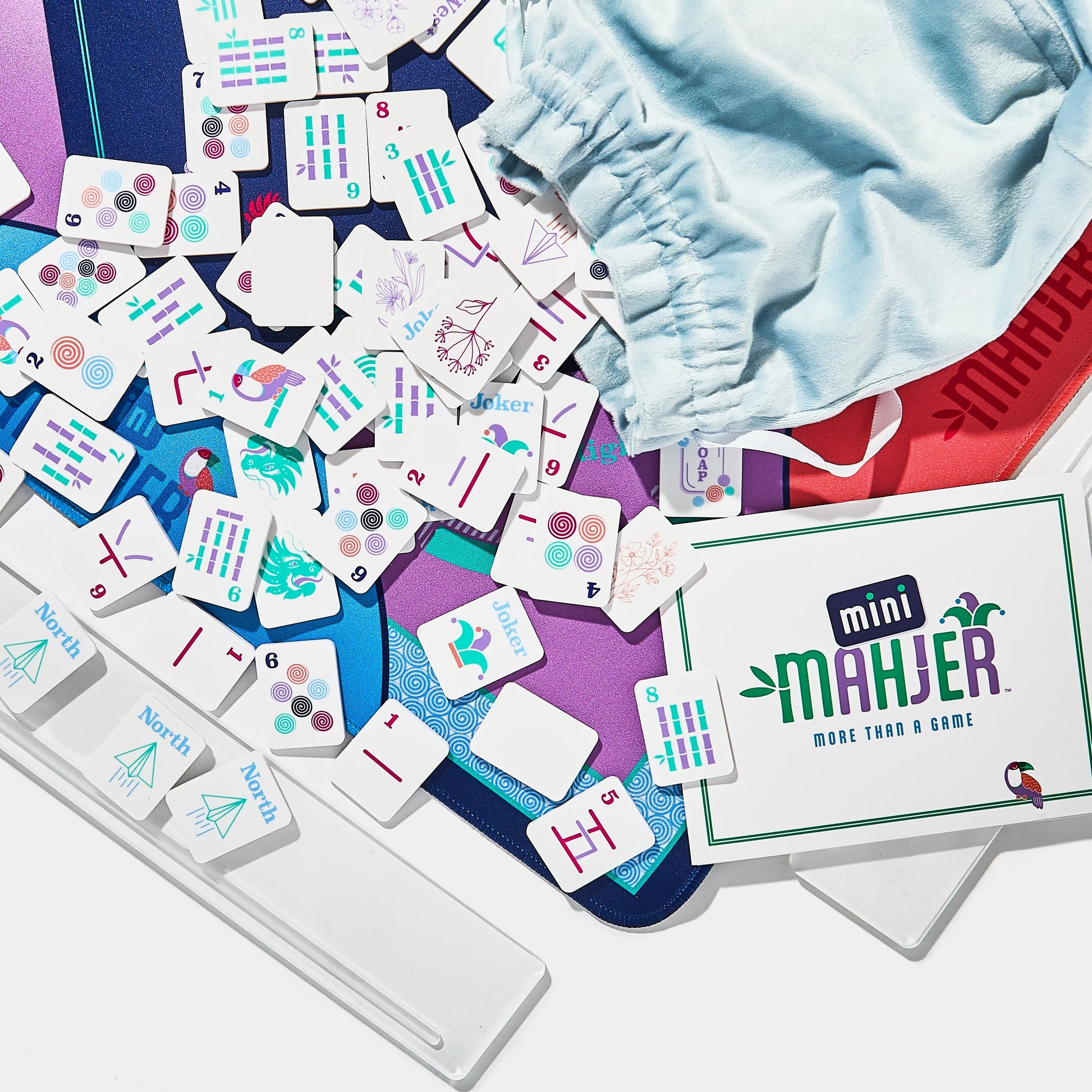 Complete Game: OG Edition by Mini Mahjer, featuring colorful game components and artwork on a clean background.
