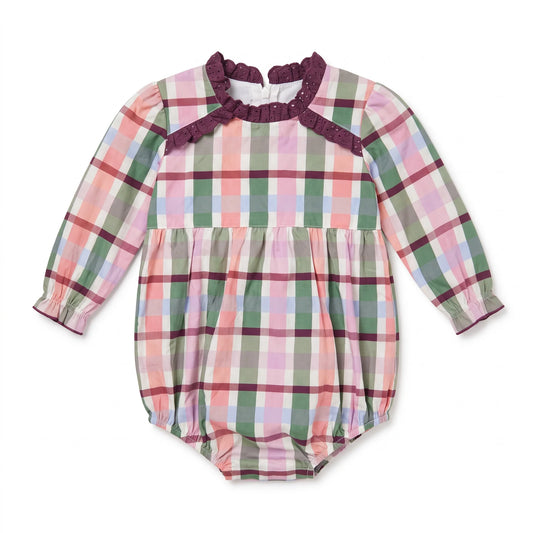 Flat lay of Hollis Baker Autumn Plaid Scarlett Bubble, a cozy plaid blanket featuring red, orange, and brown autumn-inspired patterns.