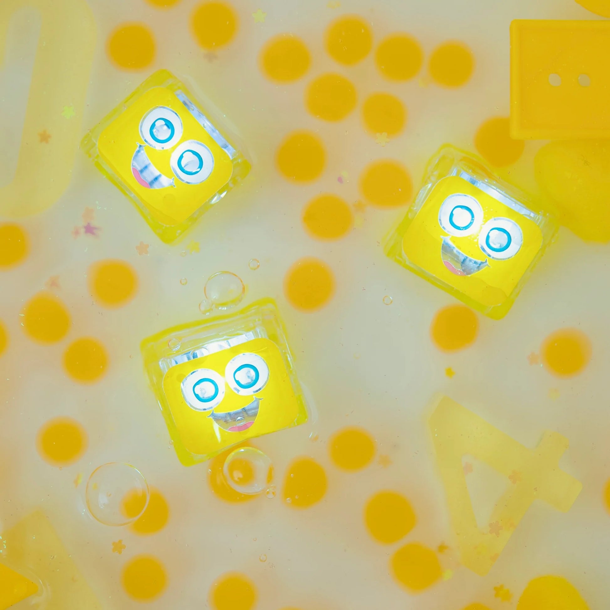 Glo Pals Alex Light Up Cubes, colorful plastic building blocks with bright LED lights, designed for kids' play and creativity.