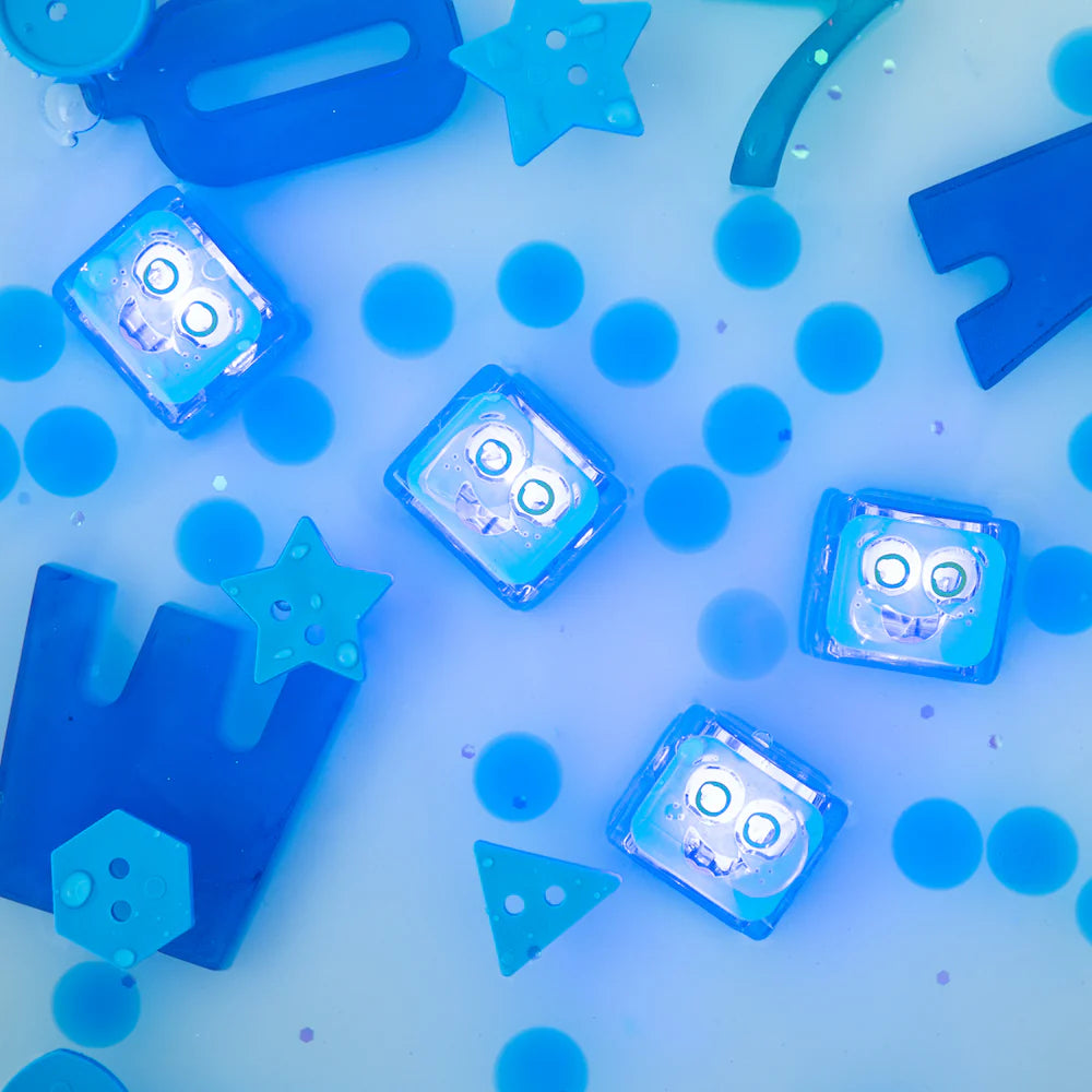 Glo Pals Blair light-up cubes in vibrant colors, featuring playful design and glowing features for kids' sensory play.