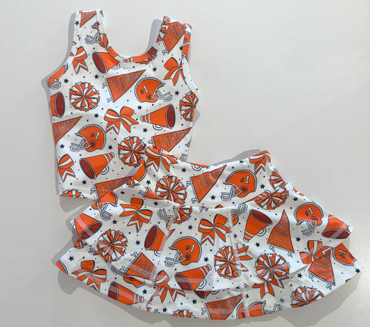 Orange cheerleader costume set for girls featuring a top, skirt, and pom-poms from Be Girl Clothing.