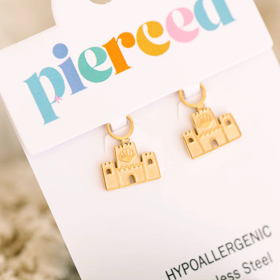 Sandcastle charms from Pierced Co featuring detailed miniature sandcastles on a neutral background.