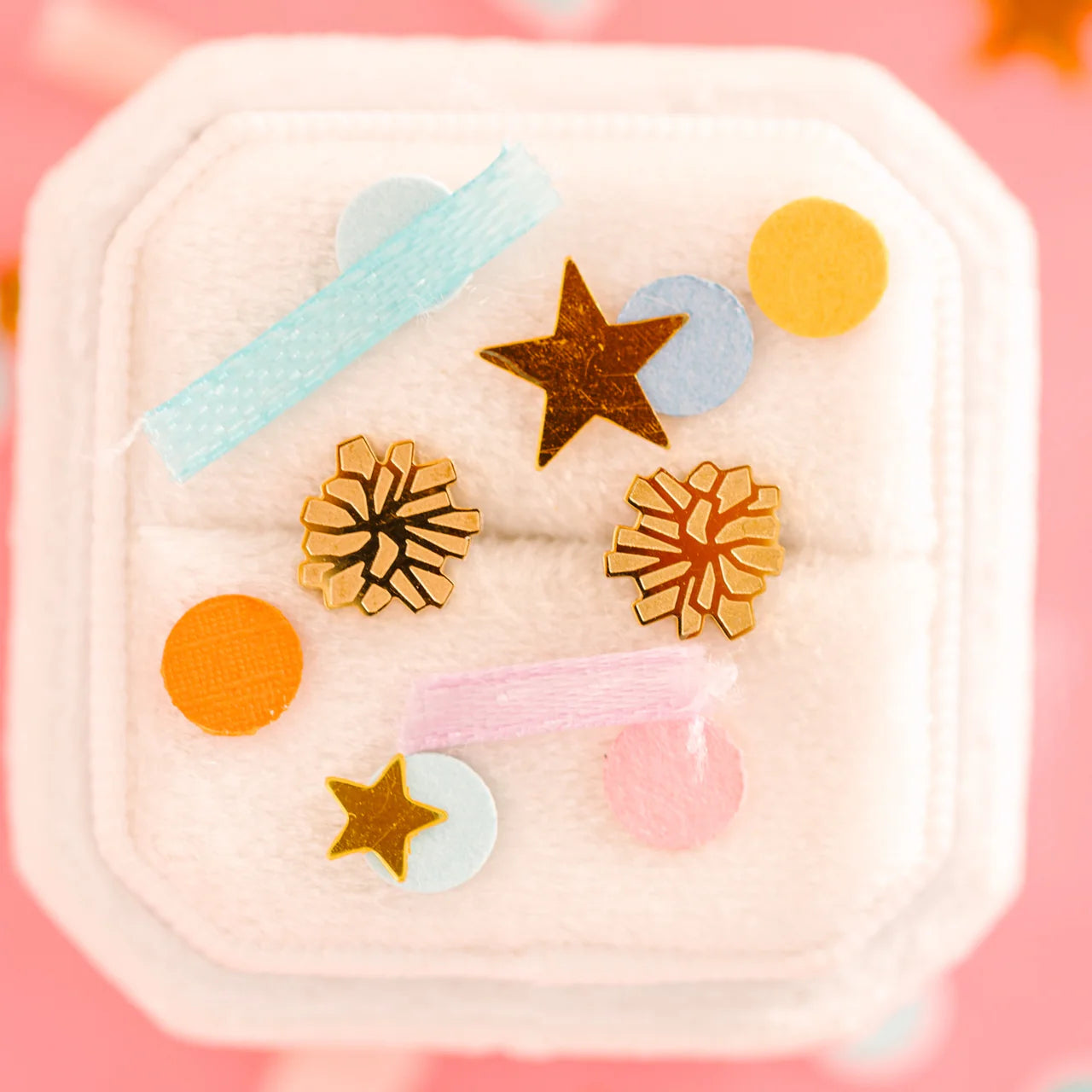Pierced Co Pom Poms SB display featuring colorful, fluffy pom pom accessories on a neutral background