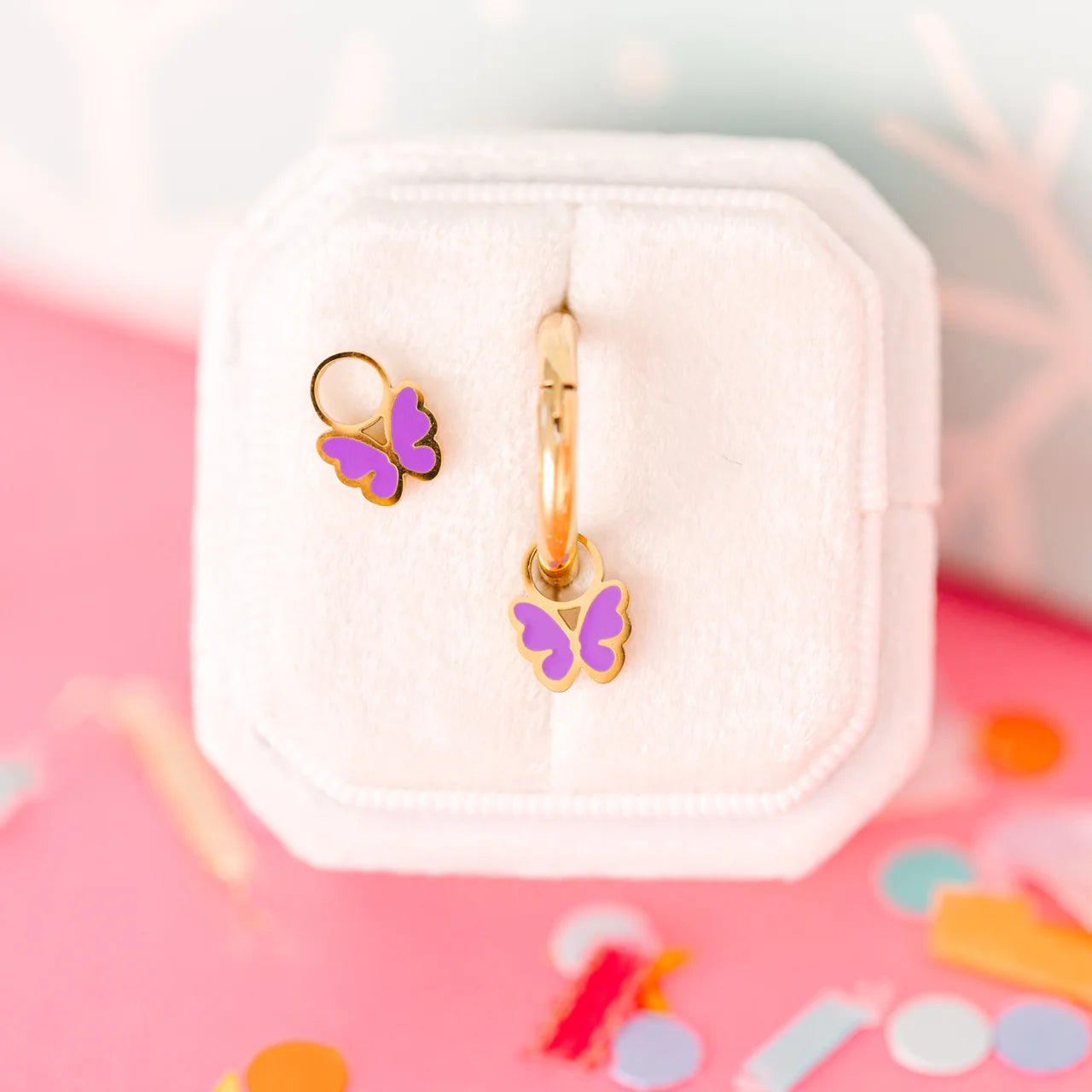 Purple butterfly charms by Pierced Co, featuring detailed metal wings and vibrant purple accents, perfect for jewelry making.