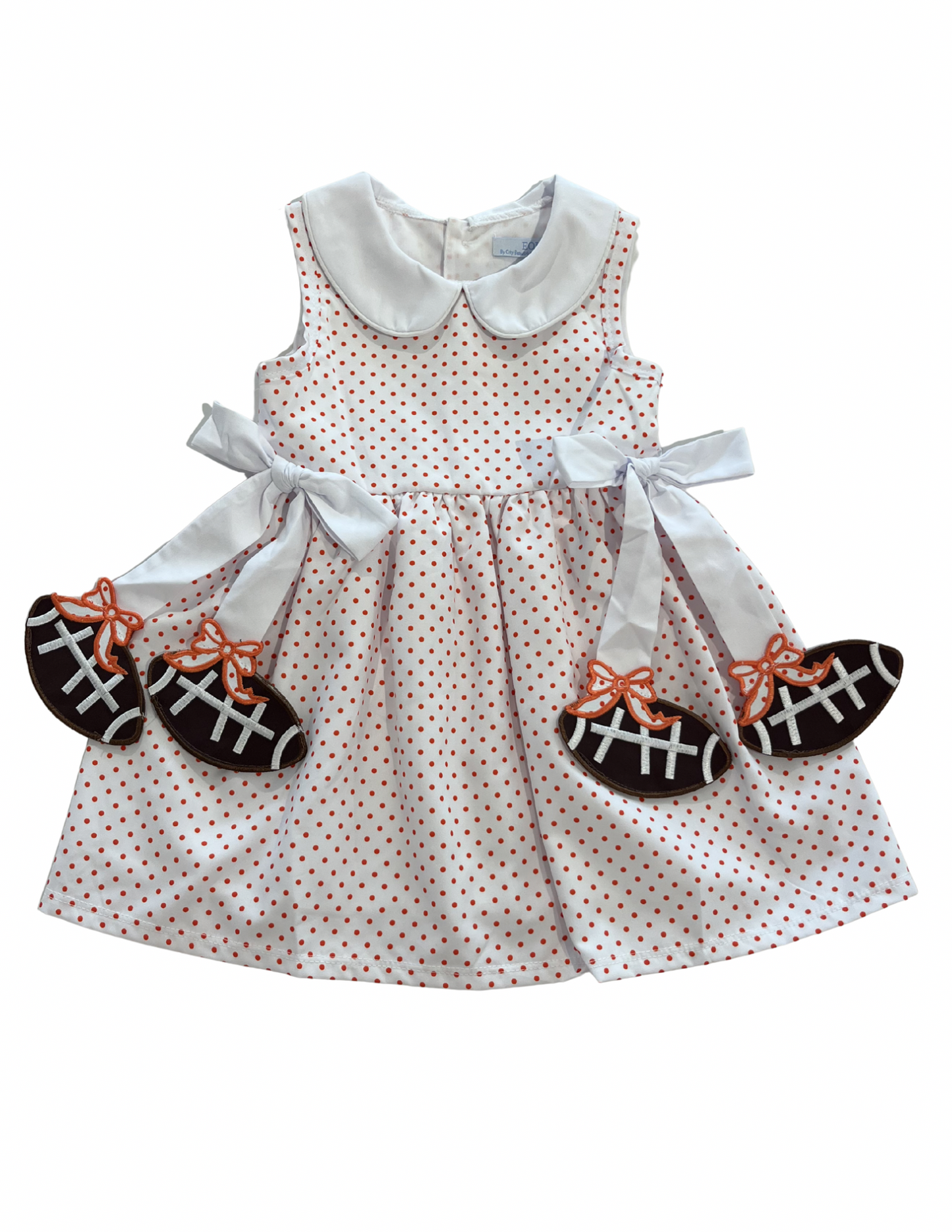 Orange football-themed dress for girls by City Beautiful Children's Boutique, featuring a playful sports-inspired design.