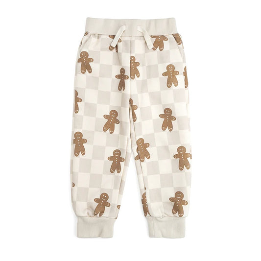 Gingerbread Christmas checkered jogger pants by Sweet Wink featuring festive red and green plaid fabric and comfortable fit.