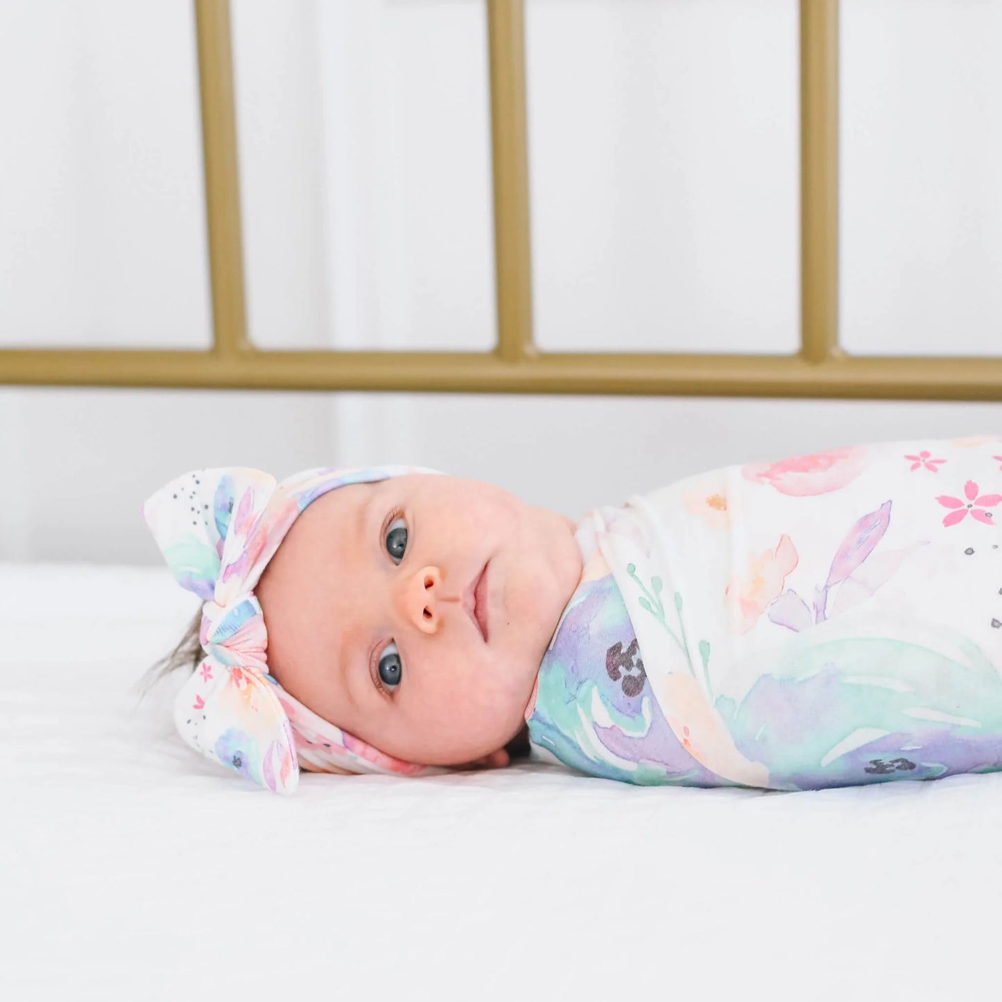 Copper Pearl Bloom Knit Headband with bow, soft and stretchy fabric for babies and toddlers, styled with a cute floral design.