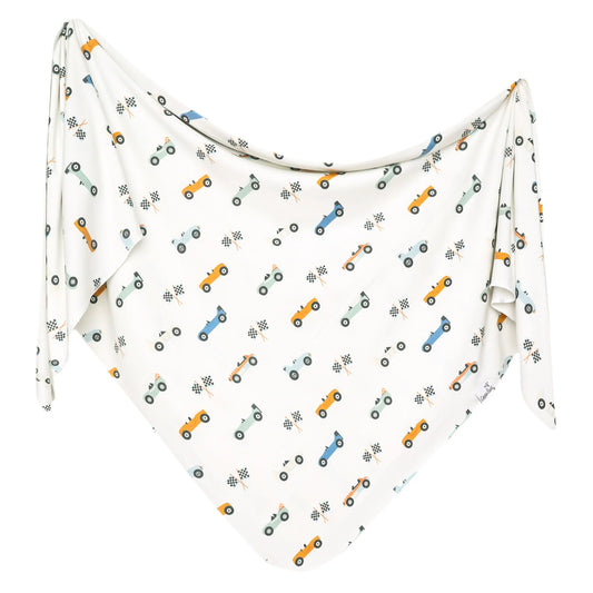 Copper Pearl Speedster Knit Swaddle Blanket featuring soft, cozy knit fabric and vibrant Speedster design for comfortable swaddling.