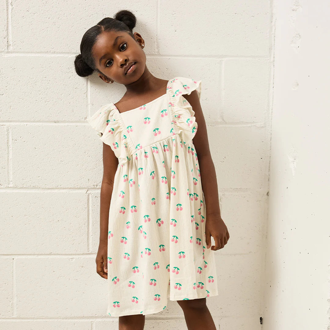Cherries printed on ivory crinkle jersey fabric dress by Miles the Label, featuring a stylish and casual design with a relaxed fit.