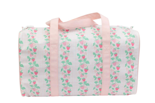 Apple of My Isla Strawberries duffle bag with pink handles and floral lining, featuring a vibrant strawberry print on beige fabric.