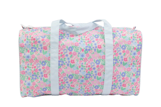 Ditsy floral Apple of My Isla duffle bag with handles and zipper closure, featuring a colorful floral pattern on fabric.