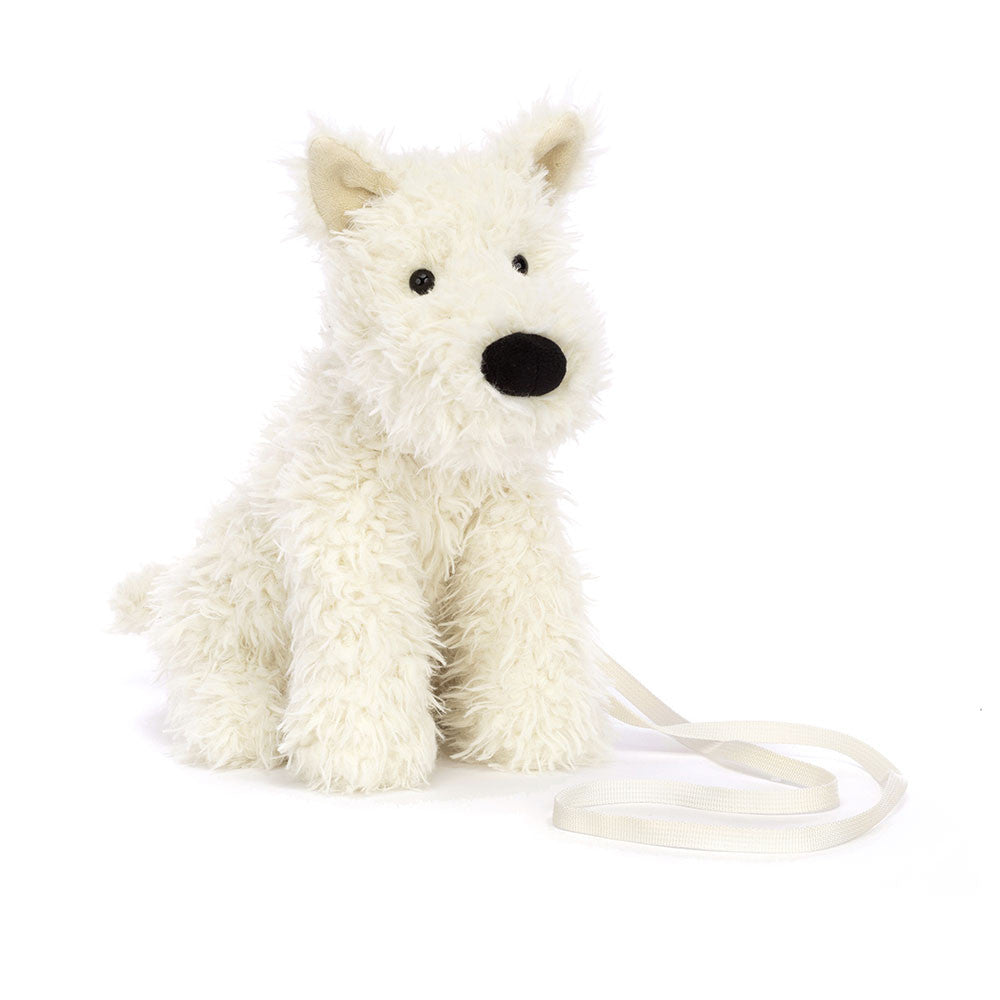 Jellycat Munro Scottie Dog bag featuring a soft plush dog design with a black and white coat and cute floppy ears.
