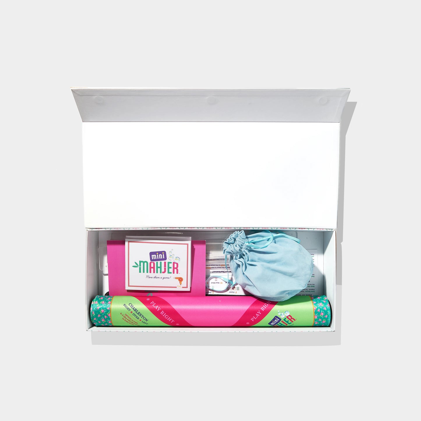 Complete Bubbles & Bows Edition game by Mini Mahjer featuring colorful game pieces and a playful game board.