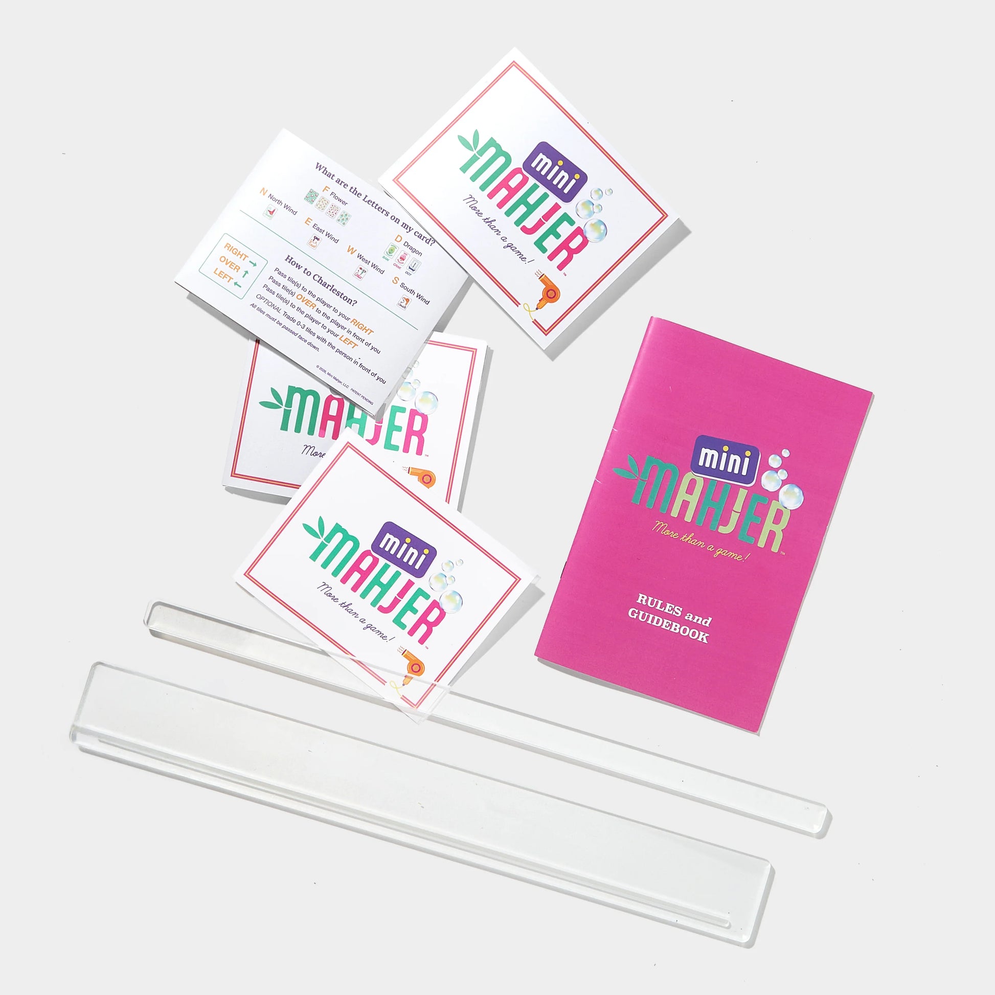 Mini Mahjer Bubbles & Bows Edition complete game box with colorful artwork and game pieces for children.