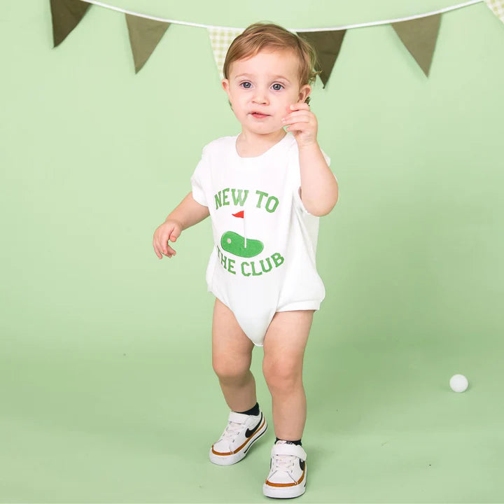 Model wearing the Sweet Wink New To The Club Patch Short Sleeve Romper, featuring a casual short-sleeve design and playful patch details.