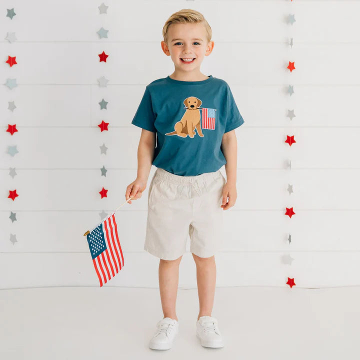 Model wearing a navy blue Sweet Wink Patriotic Pup Patch short sleeve T-shirt with a patriotic dog patch on the front.