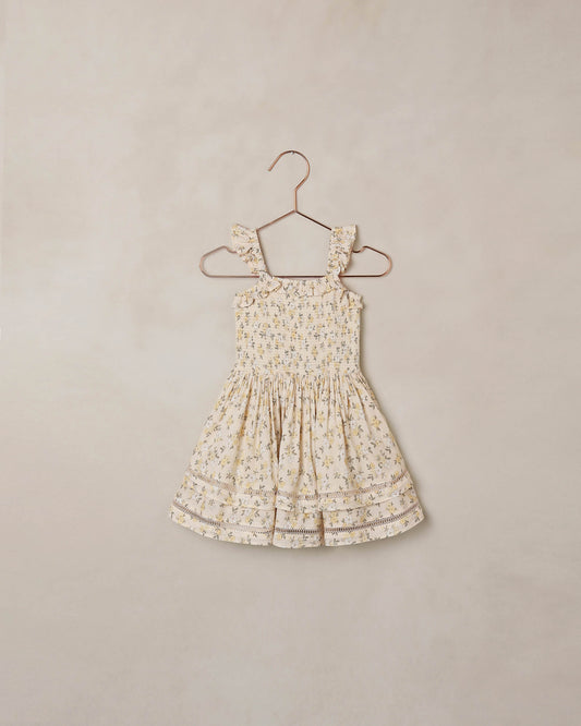 Natural-colored Lemon Meadow Birdie Dress by Noralee, featuring a floral pattern and lightweight fabric, displayed on a model.