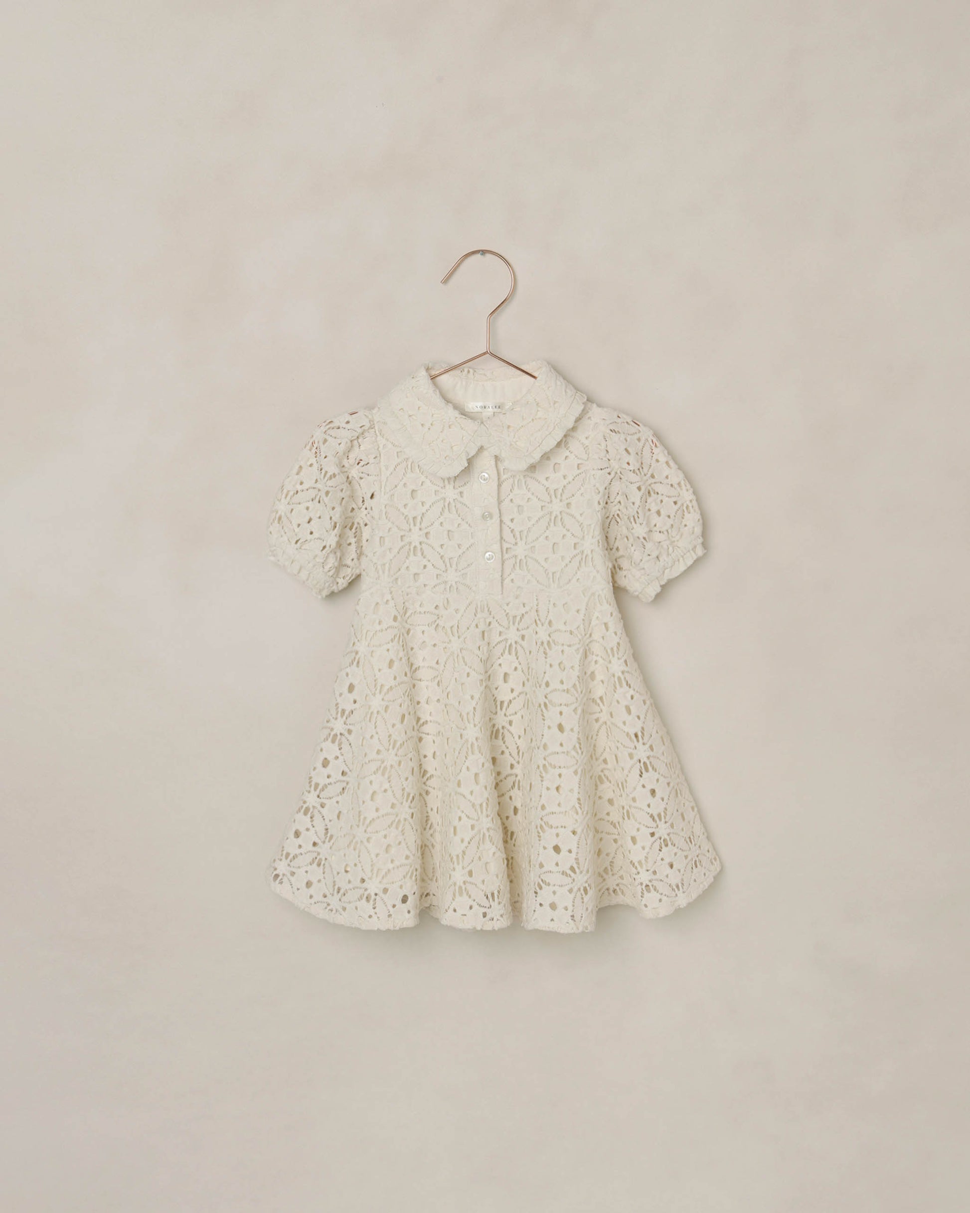 Ivory Noralee Eyelet Sara Dress featuring delicate eyelet details and a flowing silhouette.