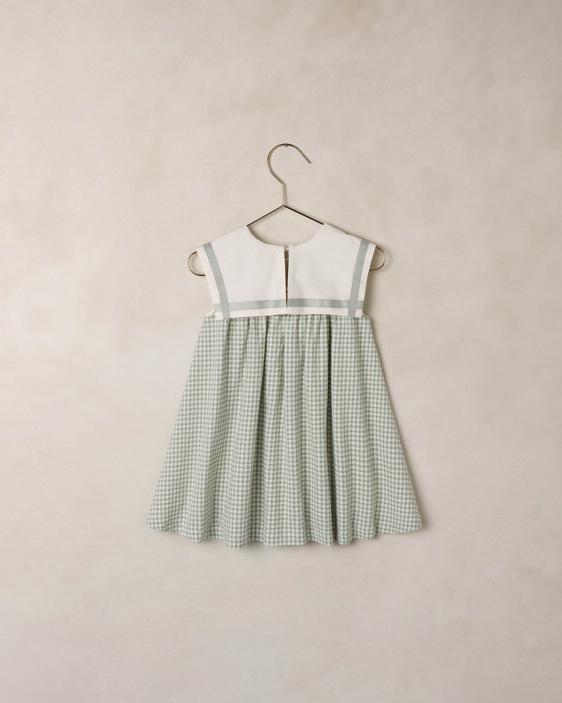 Noralee Eucalyptus Check Daisy Dress featuring a floral pattern and short sleeves, displayed on a mannequin.