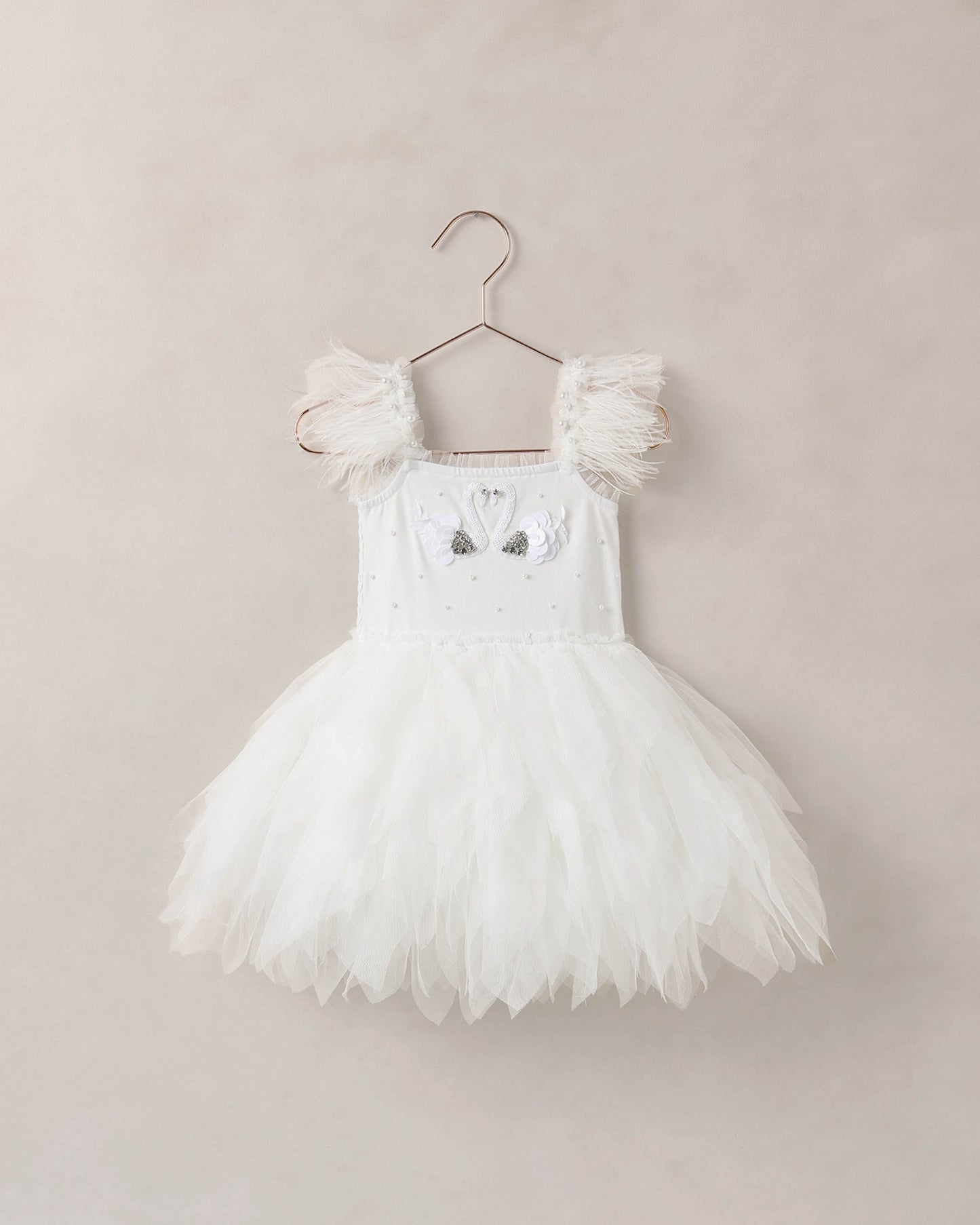 White Magique dress by Noralee, front view showcasing elegant design and flowing fabric for stylish occasions.
