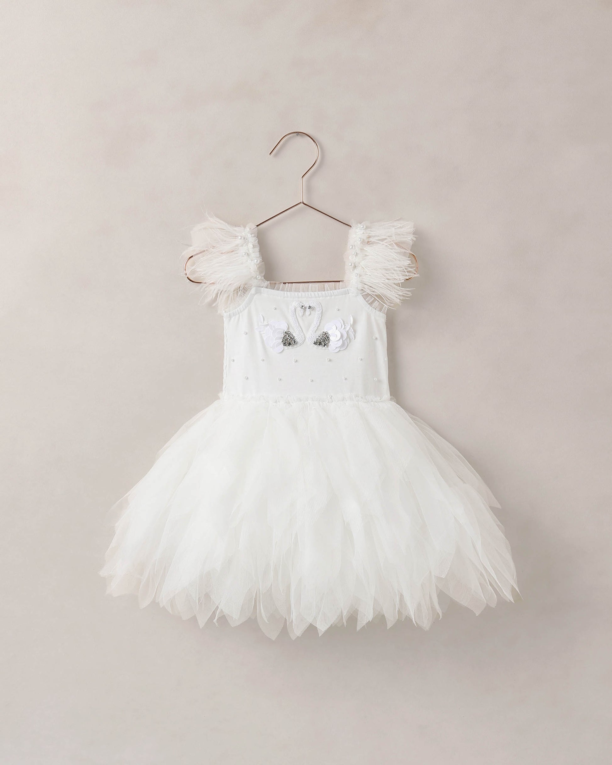 White Magique dress by Noralee, front view showcasing elegant design and flowing fabric for stylish occasions.