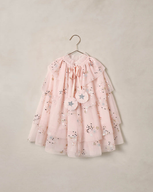 Pink tulle cape by Noralee with delicate layers and flowing design, perfect for special occasions or costumes.