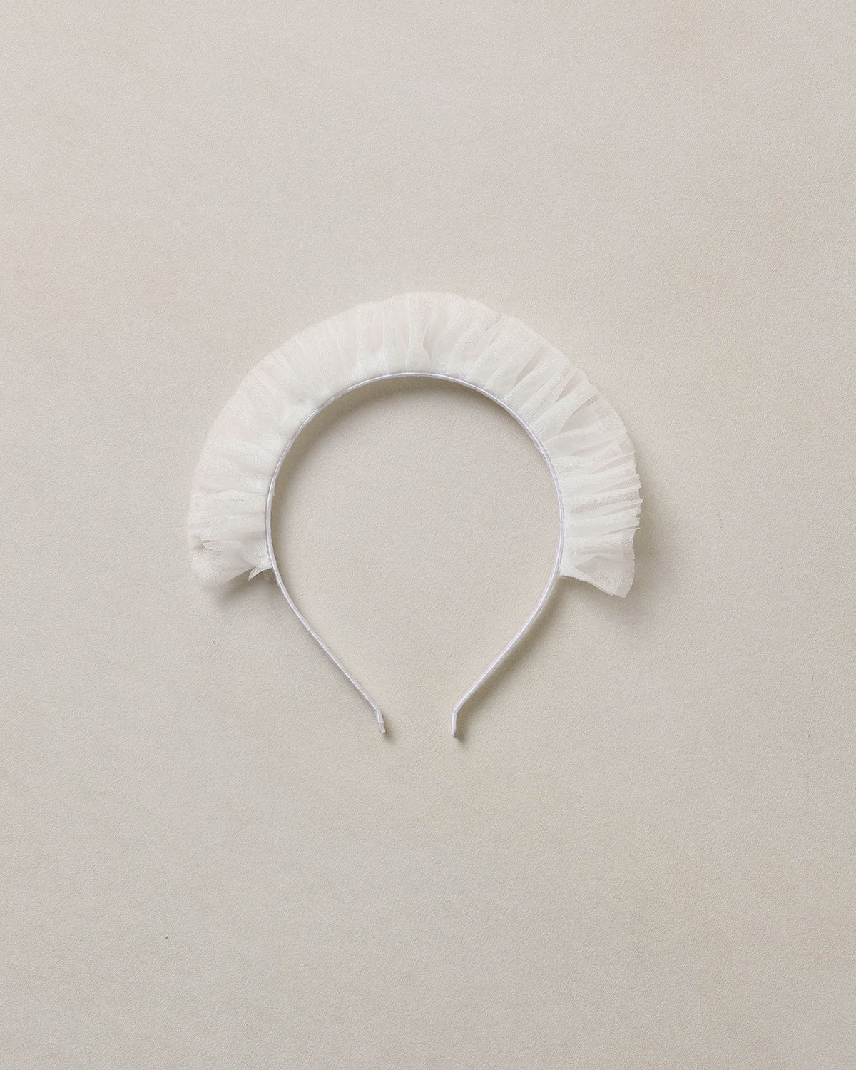 Ivory Noralee ruffle headband with soft fabric and decorative ruffles, perfect for baby or toddler hair accessories.