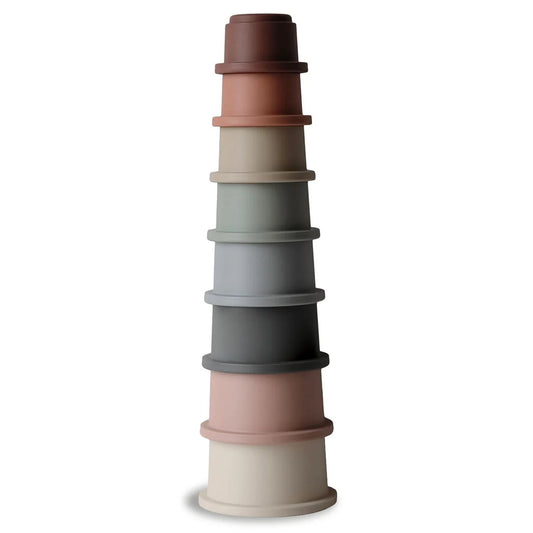 Mushie original stacking cups toy stacked with colorful plastic cups, ideal for toddlers’ play and learning.
