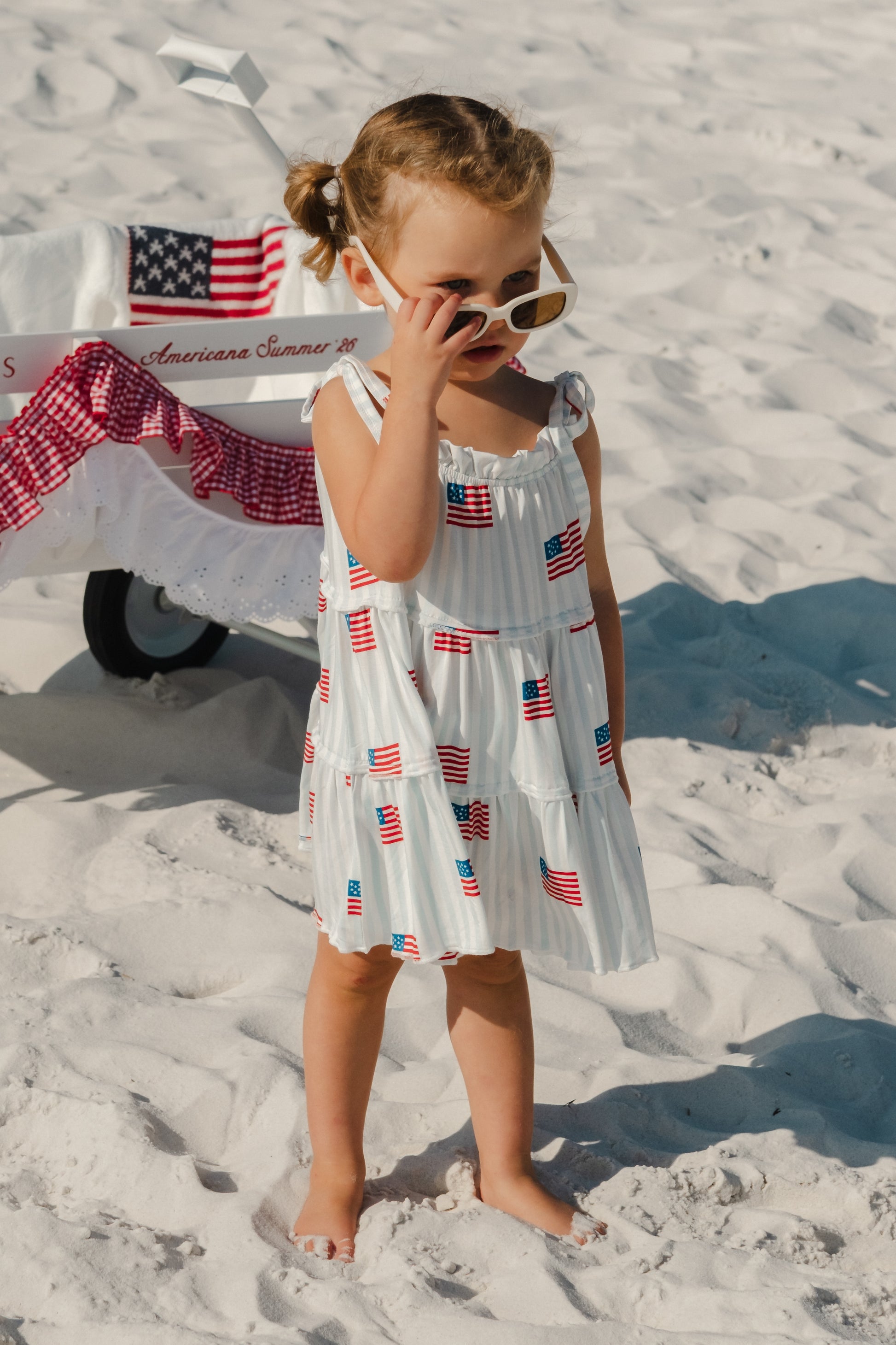 All American Tier Twirl Dress by In My Jammers, featuring colorful layered fabric and a playful, twirling style.