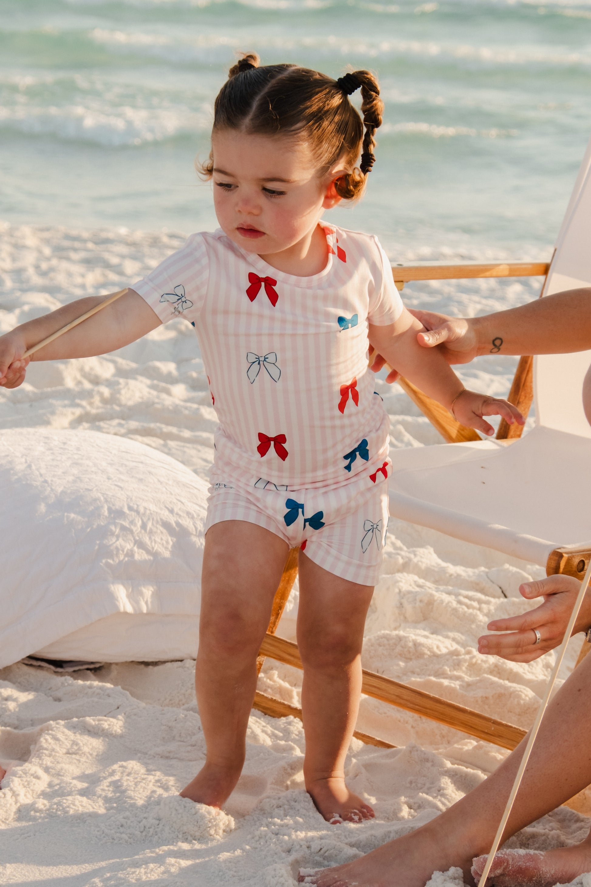 In My Jammers Liberty Bow two-piece set featuring a colorful top with bow detail and matching shorts, displayed on a mannequin.